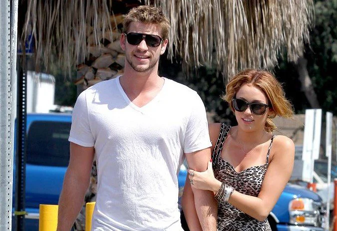 Miley Cyrus (23) and Liam Hemsworth